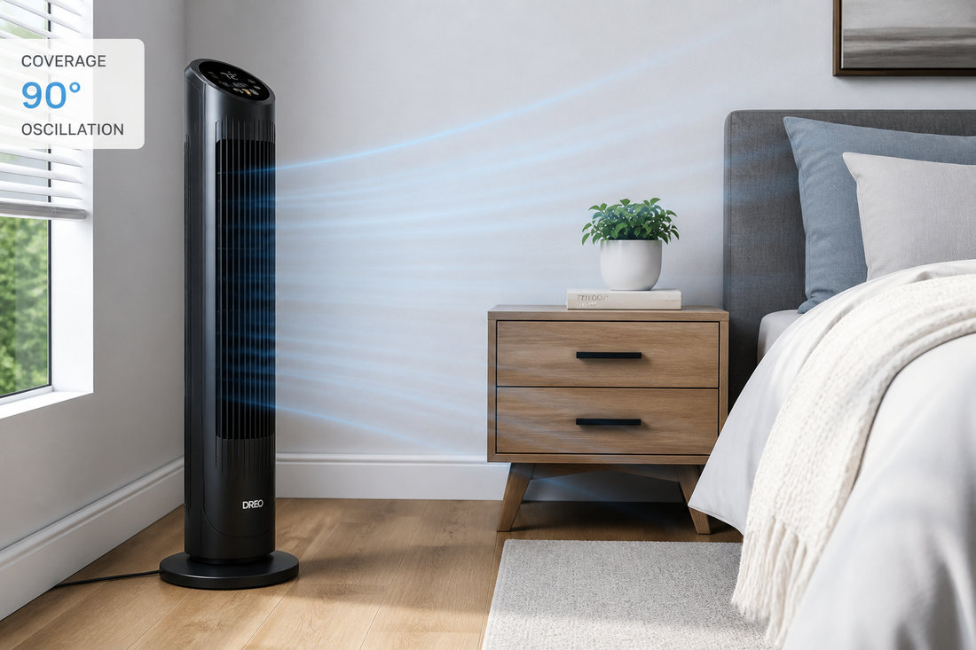 Black tower fan standing in a bedroom near a bed and nightstand