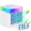 White mini water-cooled spray desk fan with colorful LED light, blowing cool air and green leaves.