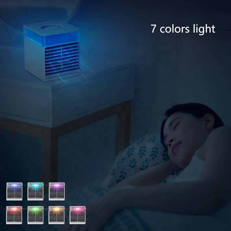 White mini water-cooled spray desk fan with blue light, on a nightstand next to a sleeping person.